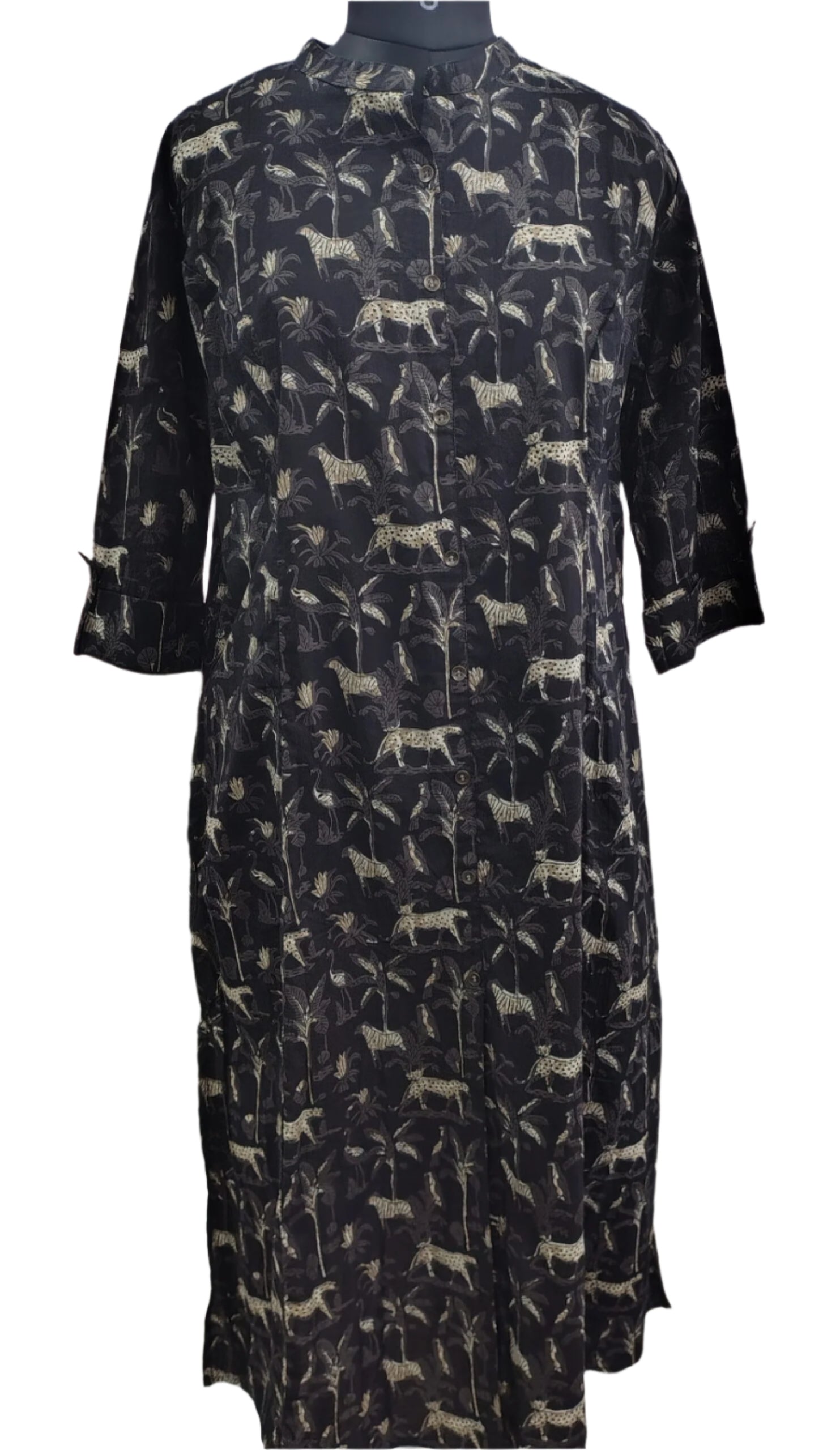 Black dress with white animal pattern on a mannequin against a white background