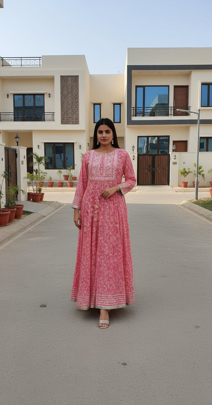 Red floral dress with intricate patterns on a white background