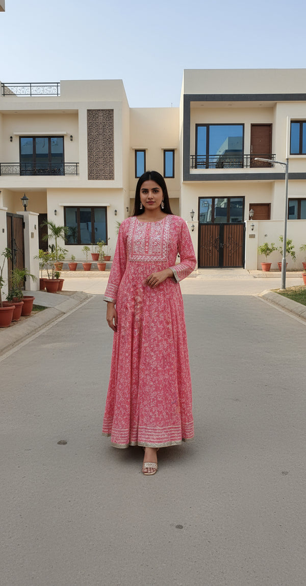 Red floral dress with intricate patterns on a white background